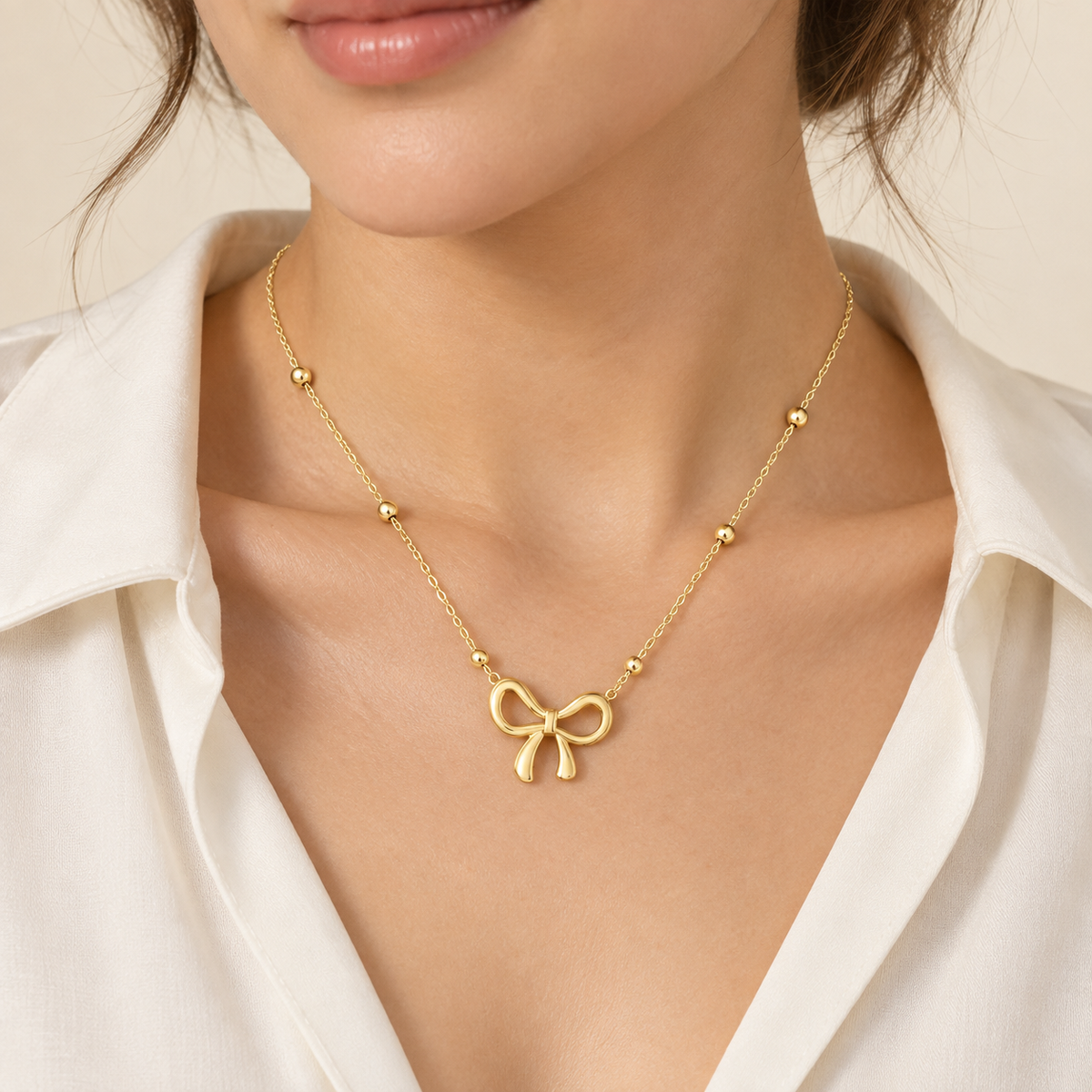 Gold bow stainless steel bracelet with delicate chain