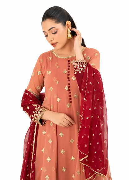 Coral pink embroidered Anarkali 3 piece Pakistani suit with red and gold border by Mai Kollachi