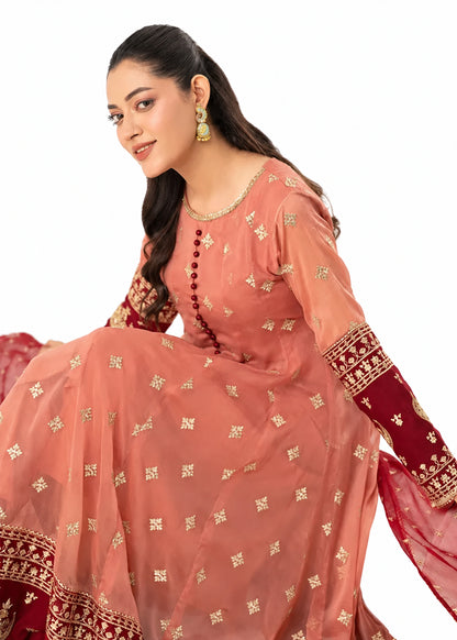 Coral pink embroidered Anarkali 3 piece Pakistani suit with red and gold border by Mai Kollachi
